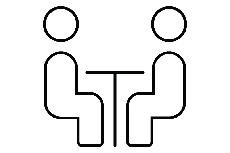 Zwei Personen sitzen sich an einem Tisch gegenüber, minimalistisches Icon.